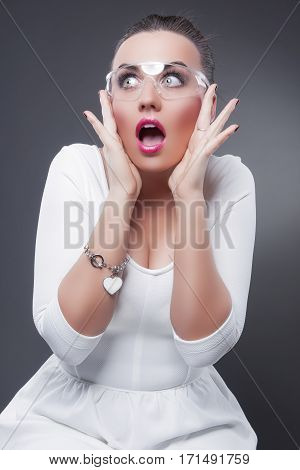 Sexy Caucasian Brunette Woman With Both Hands Lifted Showing Poisitive Facial Expression While Exclaiming. Vertical Image Orientation