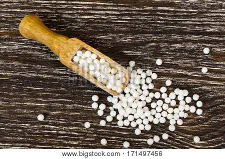 homeopathic remedy for the treatment and prevention of various diseases with the help of nature. On wood background