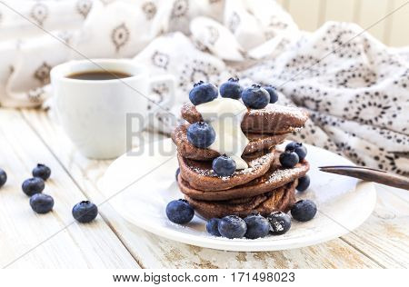 Hot Coffee And Buckwheat Chocolate Pancakes With Blueberries