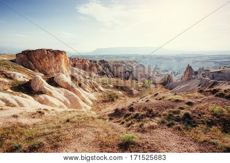 Beauty geological formations in Cappadocia, Turkey. Cappadocia with its valley, ravine, hills, located between the volcanic mountains in Goreme National Park.