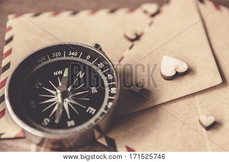 Vintage compass on the very old paper or letter envolop