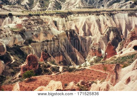 Beauty geological formations in Cappadocia, Turkey. Cappadocia with its valley, ravine, hills, located between the volcanic mountains in Goreme National Park.