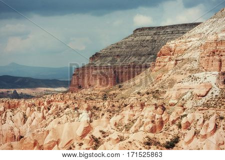 Beauty geological formations in Cappadocia, Turkey. Cappadocia with its valley, ravine, hills, located between the volcanic mountains in Goreme National Park.