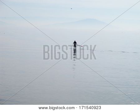 Lonely paddleboarder on the Marmara sea rowing to nowhere