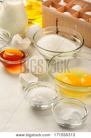 Ingredients for making pancakes on a white background