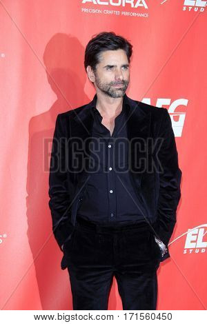 LOS ANGELES - FEB 10:  John Stamos at the Musicares Person of the Year honoring Tom Petty at Los Angeles Convention Center on February 10, 2017 in Los Angeles, CA