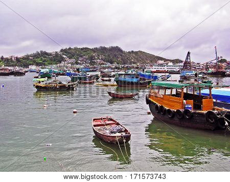 Cheung Chau, Hong Kong - March 22, 2003: Harbour of the island of Cheung Chau with many fishing boats.
