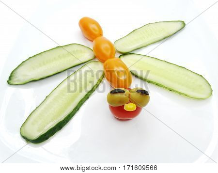 creative funny vegetable food snack with cuccumber dragon form