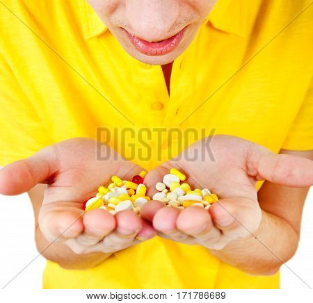 Young Man hold a Pills in the Hands closeup