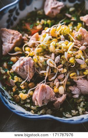 Salad with chicken and beans in bowl close up vertical