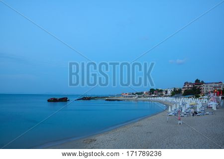 coastline with views of the city under the night sky