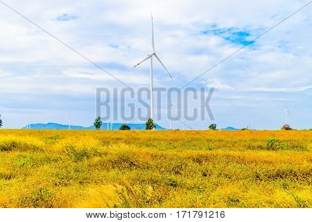Electricity wind turbine tower generator with blue sky