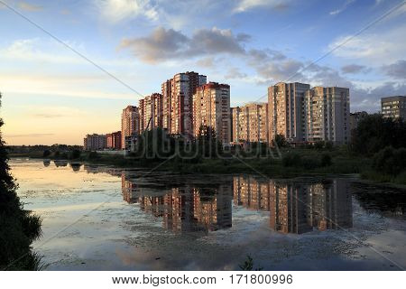 New residential district on the bank of the river Pekhorka during sunset. Balashikha, Moscow region, Russia