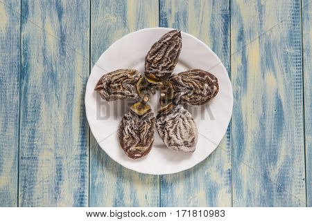 Dried persimmon on blue wooden background