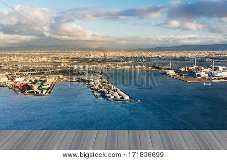 Opening wooden floor Industrial District at Osaka Bay and city downtown in Japan