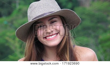 A Happy Teen Girl  Wearing a Hat