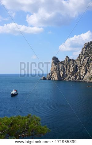 Pleasure boat in the sea bay. The village of Novy Svet. Crimea. Black Sea