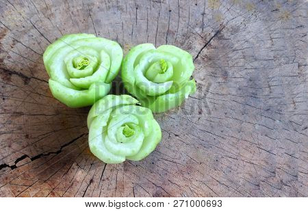 Roses From Rearrange Of Cutting Lettuce On Wooden Plate Or Chopping Block