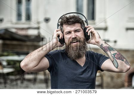 Hipster Enjoy High Quality Sound Of Song In Headphones. Get Music Subscription. Enjoy Free Songs Eve