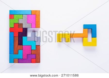 Keyhole And Key, Logical Concept. Logical Tasks Composed Of Colorful Wooden Shapes, Top View.