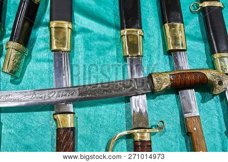 Hilt And Part Of The Saber Blade, Half Pushed Out Of The Sheath, Close-up Against Another Cossacks S