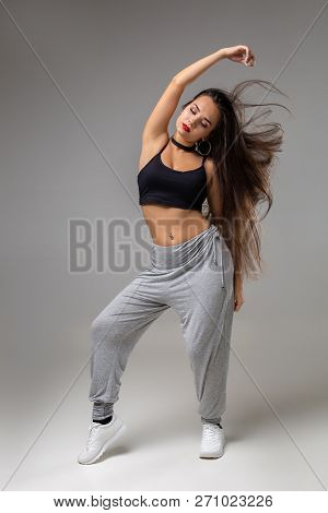 Modern Style Dancer Posing On Studio Background. Hip Hop, Jazz Funk, Dancehall