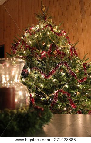 Warm Cottage Ambience With A Big Decorated Natural Christmas Tree.