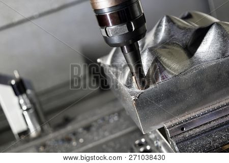 The  Cnc Milling Machine Cutting The Mold Part With The Index-able Ball End Mill Tool In Roughing Pr