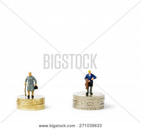 Small Figurines And Stacks Of Euro Coins On Bright Background. Economic Inequality By Gender. Inequa