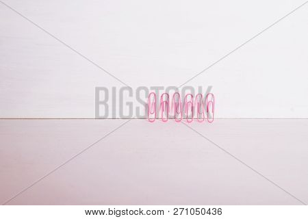 Office Supplies.the Composition Row Of Multi-colored Paper Clips On Pnk, Pastel Background.colorful 