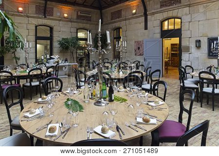 Mello, France - August 26, 2018: Tables Set For Dinner In The Dining Room Of The Old Castle. France.
