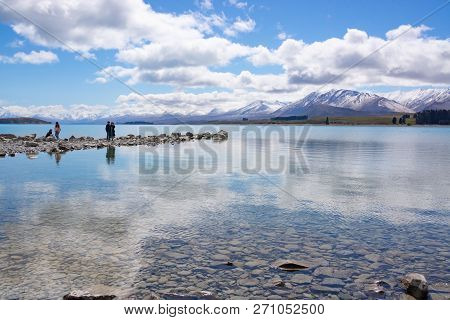 Collingwood, New Zealand - October 5 2018; Family Four Asian Tourists Photographing Scenery And Enjo