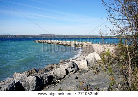 Boulders Serve As A Breakwall To Protect The Bay View Swimming Beach From The Effect Of Waves, In Ba