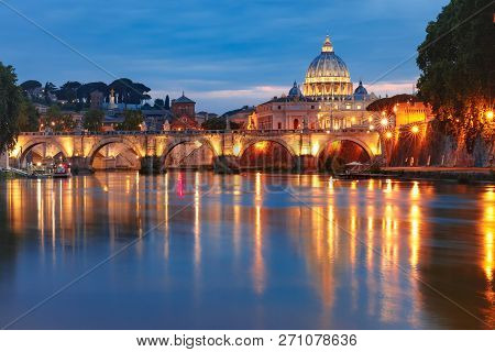 Saint Peter Cathedral And Saint Angel Bridge Over The Tiber River During Morning Blue Hour In Rome, 