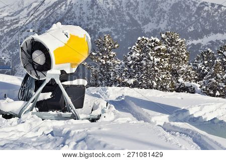Snow Cannon On The Snow In The Mountains. Ski Resort In The Pyrenees, Andorra, On A Sunny Winter Day
