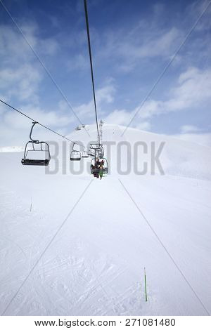 Chair-lift, Snowy Ski Slope And Cloudy Sky With Falling Snow. Caucasus Mountains At Winter, Georgia,