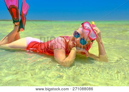 Happy Lifestyle Woman With Snorkeling Wetsuit, Mask And Fins Pink And Peach Color, Sunbathing Lying 