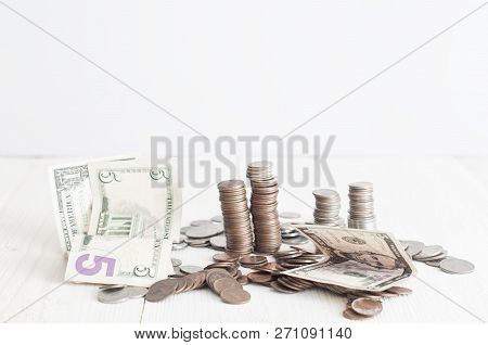Piles Of American Cents And 5, 1 Dollars Banknotes