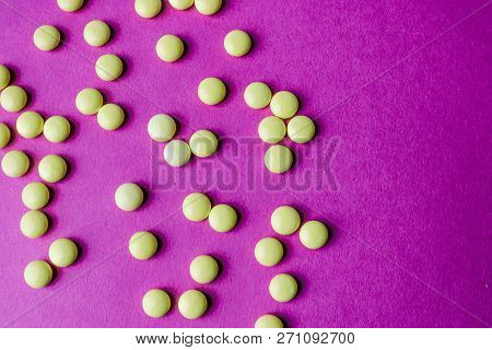 Small Yellow Orange Beautiful Medical Pharmaceptic Round Pills, Vitamins, Drugs, Antibiotics On A Pi