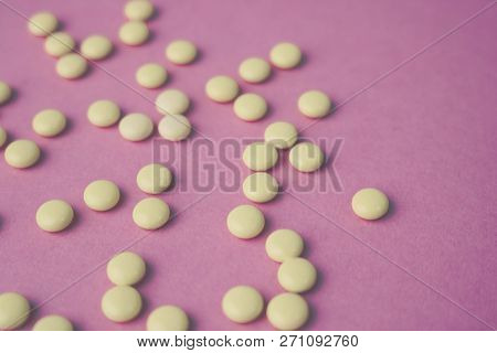Small Yellow Orange Beautiful Medical Pharmaceptic Round Pills, Vitamins, Drugs, Antibiotics On A Pi