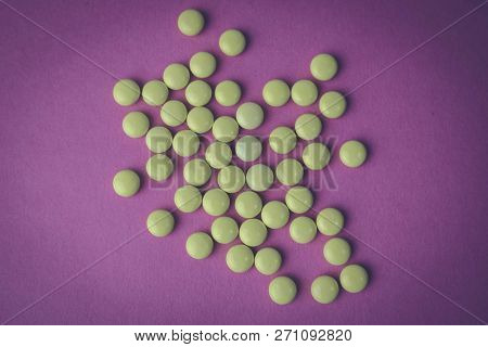 Small Yellow Orange Beautiful Medical Pharmaceptic Round Pills, Vitamins, Drugs, Antibiotics On A Pi