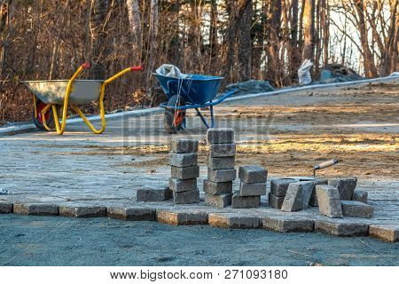 Construction Site And Paving On A Walking Path In A Public Park. Scene Of Preparatory Work With Cart