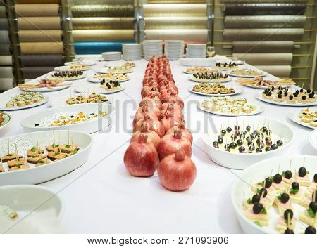 Party Event Buffet Table With Assortment Of Canapes And Pomegran