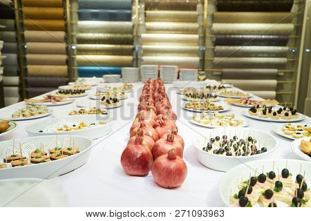 Party Event Buffet Table With Assortment Of Canapes And Pomegran