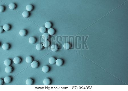 Small Yellow Orange Beautiful Medical Pharmaceptic Round Pills, Vitamins, Drugs, Antibiotics On A Bl