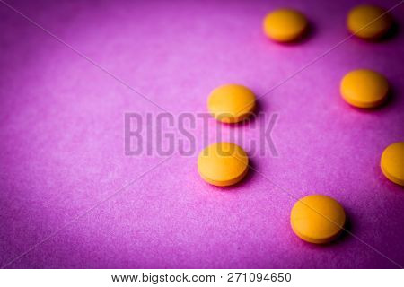 Small Yellow Orange Beautiful Medical Pharmaceptic Round Pills, Vitamins, Drugs, Antibiotics On A Pi