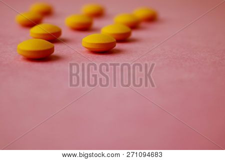 Small Yellow Orange Beautiful Medical Pharmaceptic Round Pills, Vitamins, Drugs, Antibiotics On A Pi