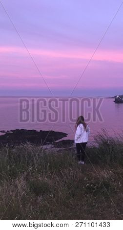 This Photo Shows The True Beauty Of Nature A Young Lady Overlooking A Purple Pink Sky With The Refel