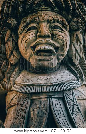 Closeup Portrait Of Hindu Buddhist Traditional Stone Sculpture. Bali, Indonesia