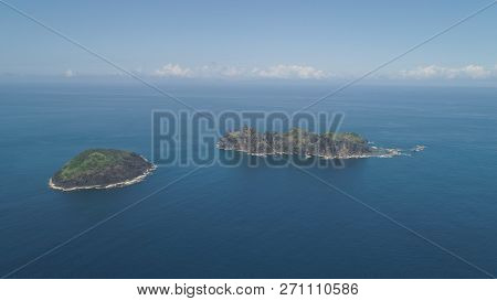 Small Rocky Islands In The Sea, Blue Sky And Clouds. Dos Hermanas, Palau, Santa Ana. Aerial View Of 